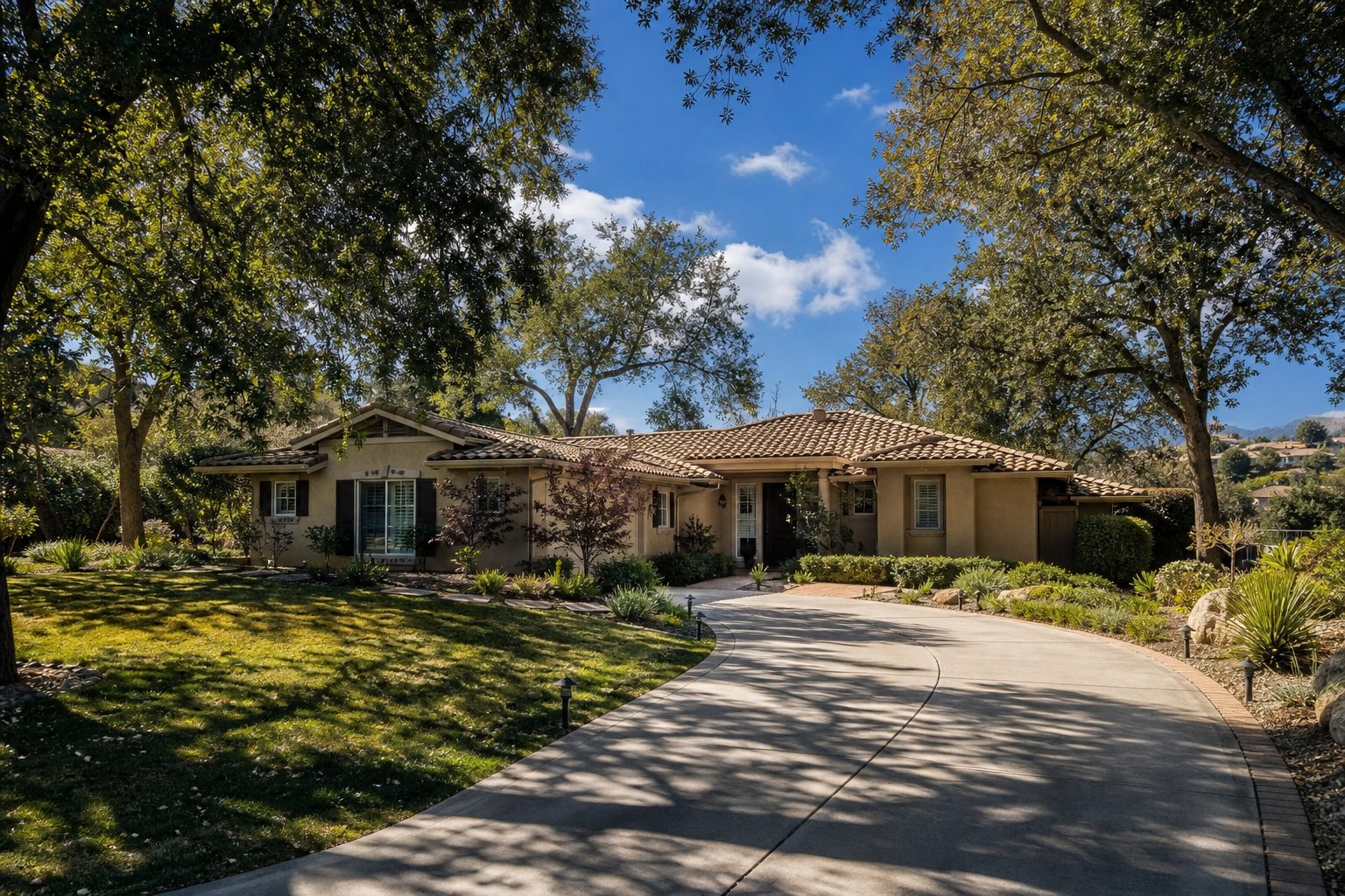 Established single-story ranch home with mature oak trees and native landscaping on large lot in established Valencia neighborhood.